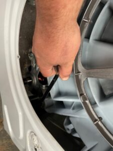 removing the bolts holding a bosch washing machine motor on
