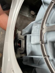 removing the bolts holding a bosch washing machine motor on