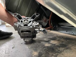 removing the earth wire and motor connector block from a bosch washing machine